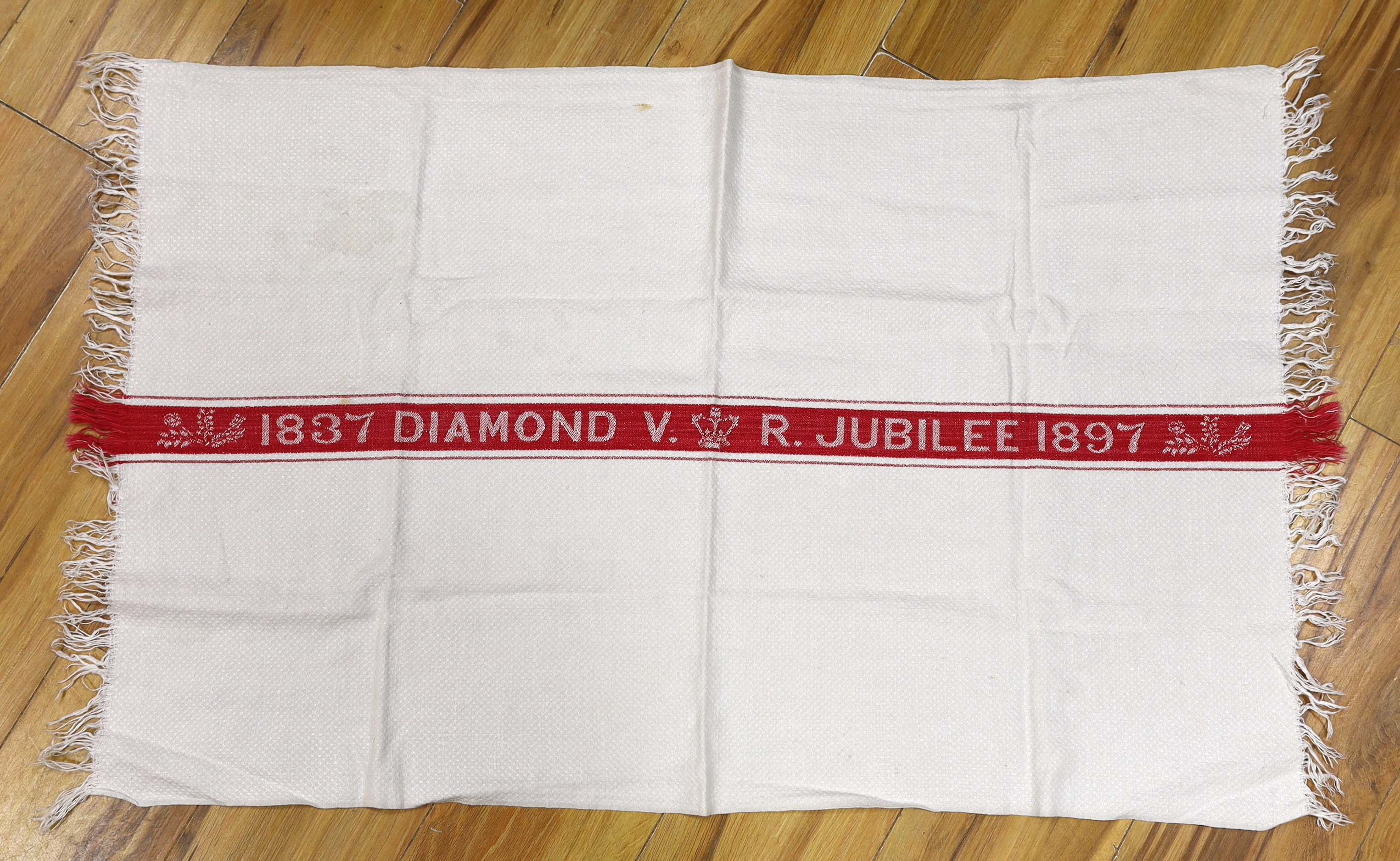 An unusual Victorian jubilee damask hand towel, 1897, and a lace stole, lace trimming and a pair of chamois leather gloves, hand towel 94cm long x 61cm wide